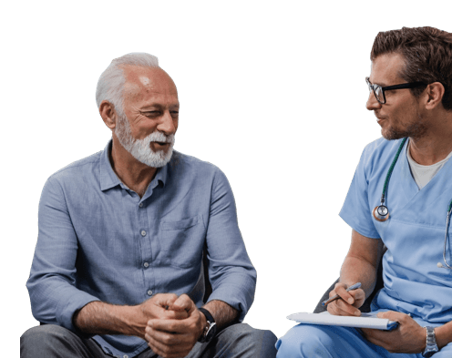 A man talks with his doctor while smiling